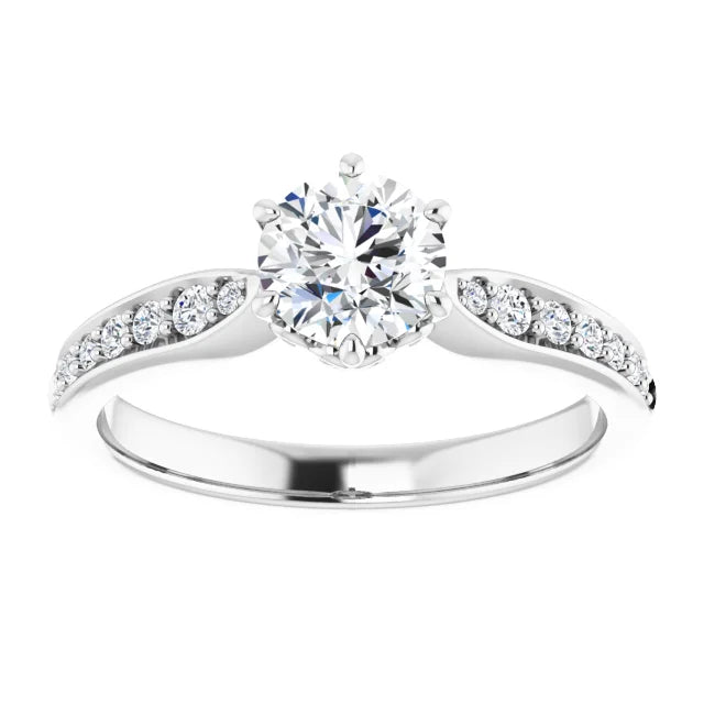 White gold diamond engagement ring with a diamond band on a white background