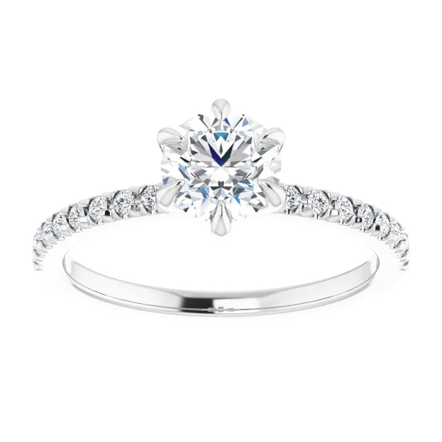 White gold diamond engagement ring with a diamond band on a white background