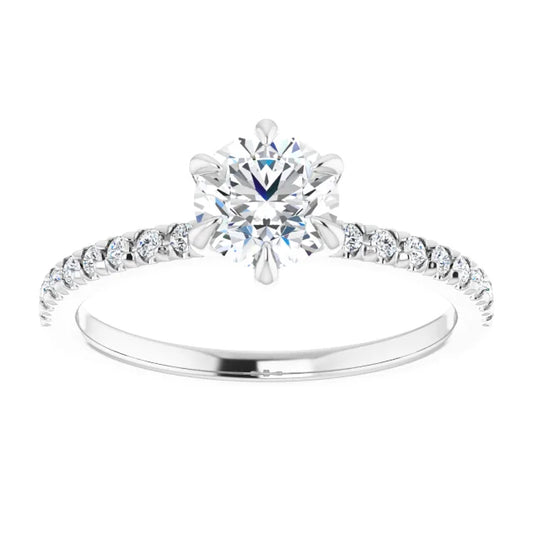 White gold diamond engagement ring with a diamond band on a white background