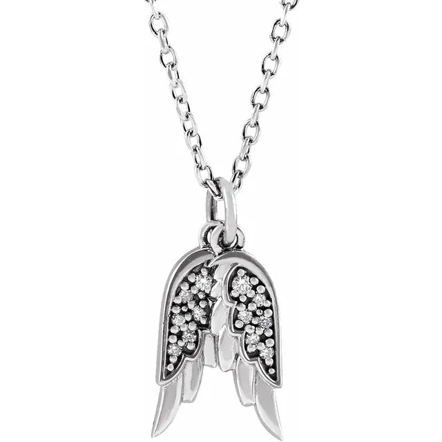 White gold diamond angel wing necklace on a white background.