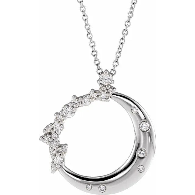 White gold diamond crescent moon necklace on a white background.