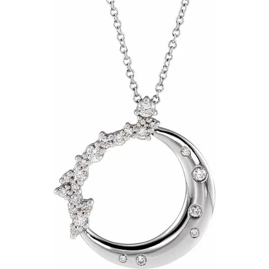 White gold diamond crescent moon necklace on a white background.