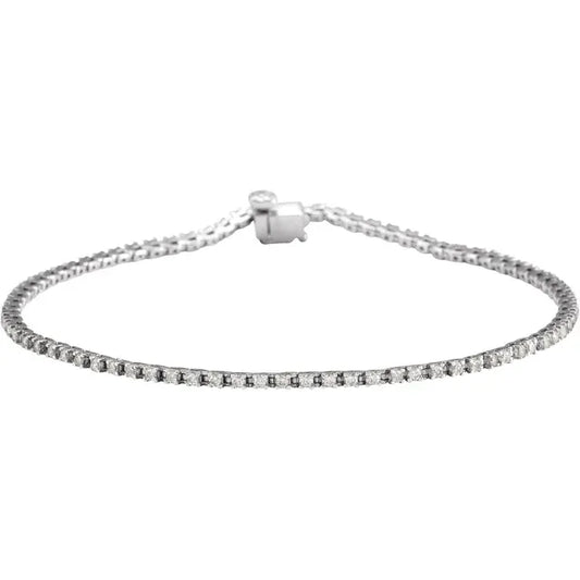 Silver tennis bracelet with a clasp on a white background