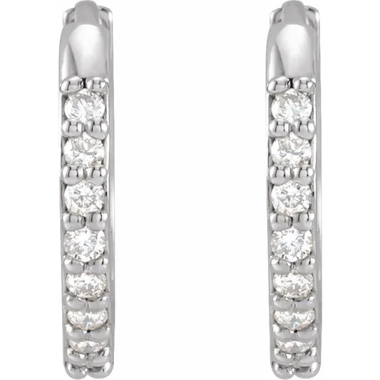 White gold diamond hoop earrings on a white background.