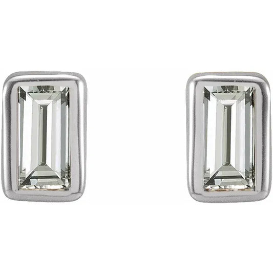 White gold baguette diamond stud earrings on a white background