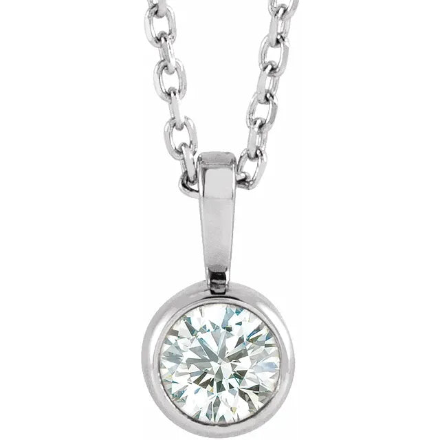 White gold bezel-set diamond pendant on a white background.