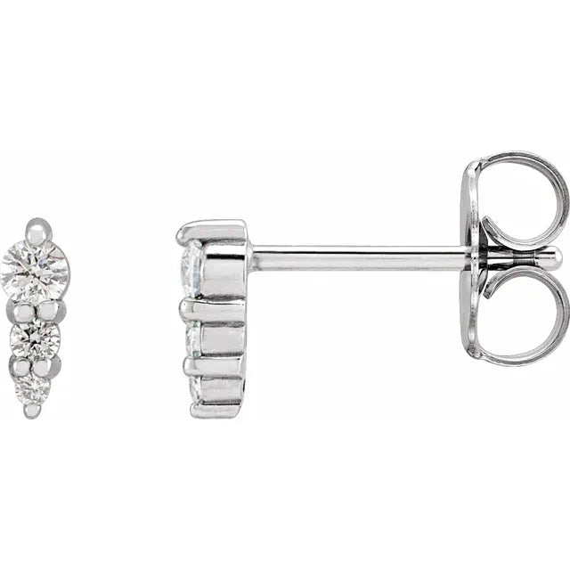 White gold diamond stud earrings on a white background.