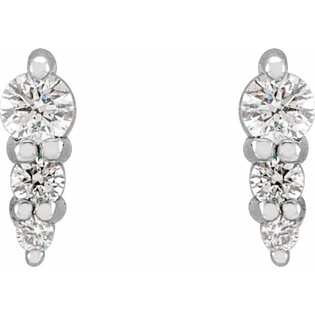 White gold diamond stud earrings on a white background.