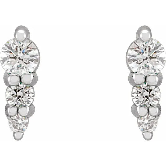 White gold diamond stud earrings on a white background.