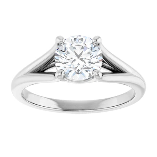 White gold three-stone diamond engagement ring on a white background.