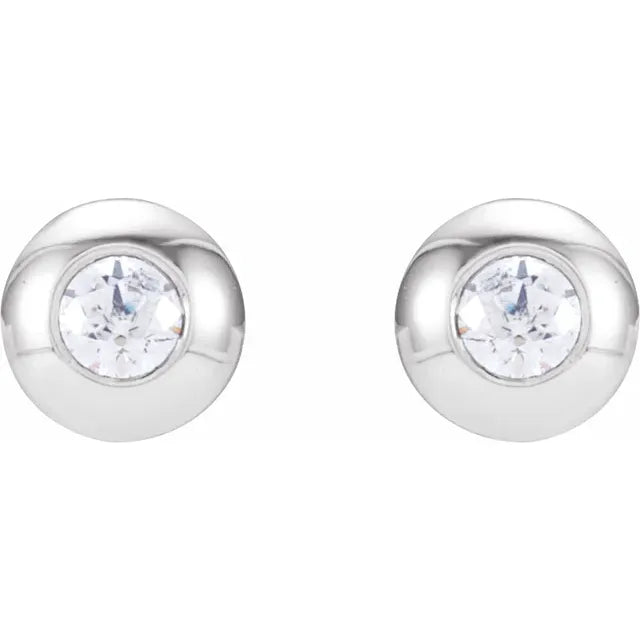 White gold diamond stud earrings on a white background