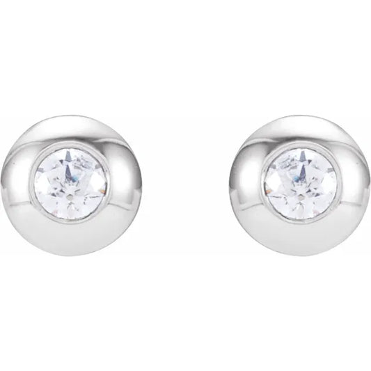 White gold diamond stud earrings on a white background