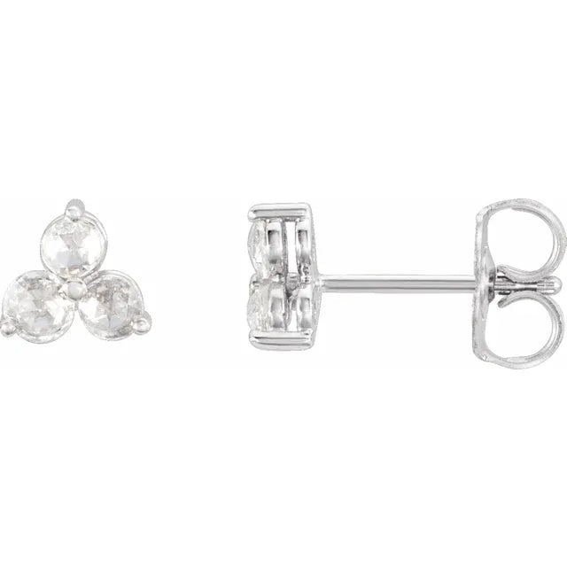 Pair of diamond trefoil stud earrings on a white background