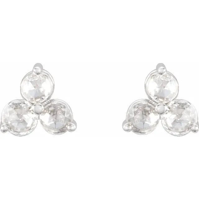 Pair of diamond trefoil stud earrings on a white background