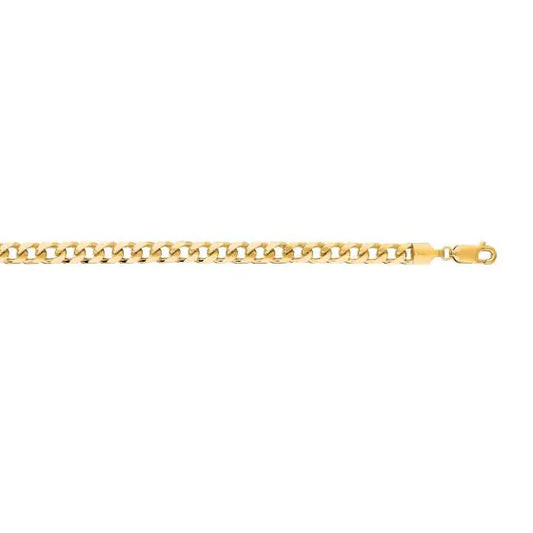 Yellow gold Cuban link bracelet on a white background.