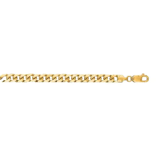 Yellow gold Cuban link bracelet on a white background.