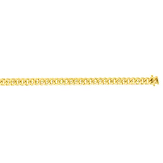 Yellow gold Cuban link bracelet on a white background.