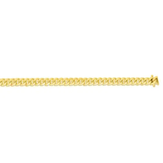 Yellow gold Cuban link bracelet on a white background.