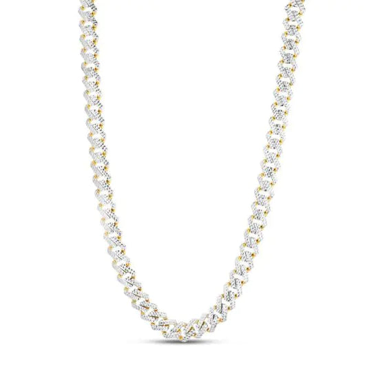  Two-tone gold Cuban link chain necklace with diamond accents on a white background.