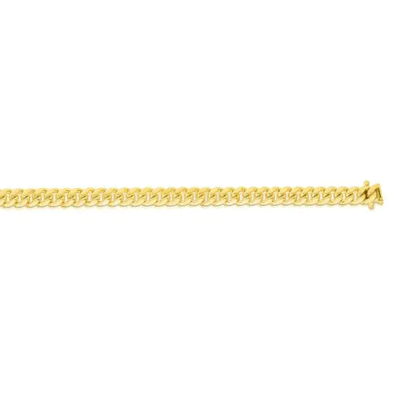 Yellow gold Cuban link chain  on a white background.